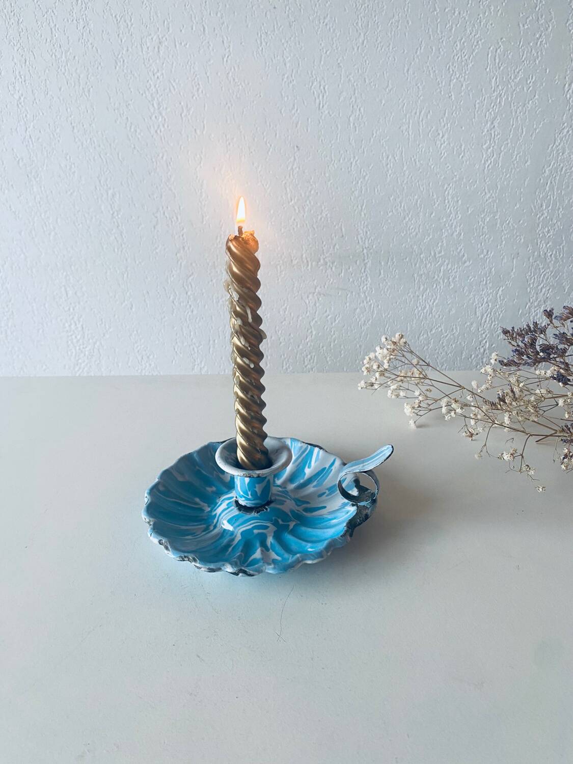 Old blue enameled metal candle holder