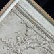 Plaster ceiling fragment framed