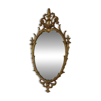 Oval brass mirror from the 19th century.