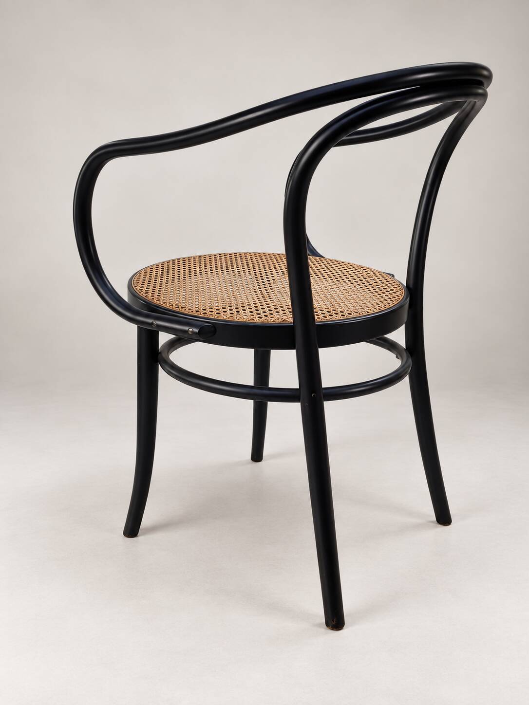Thonet armchair in bent wood and caning – Czechoslovakia