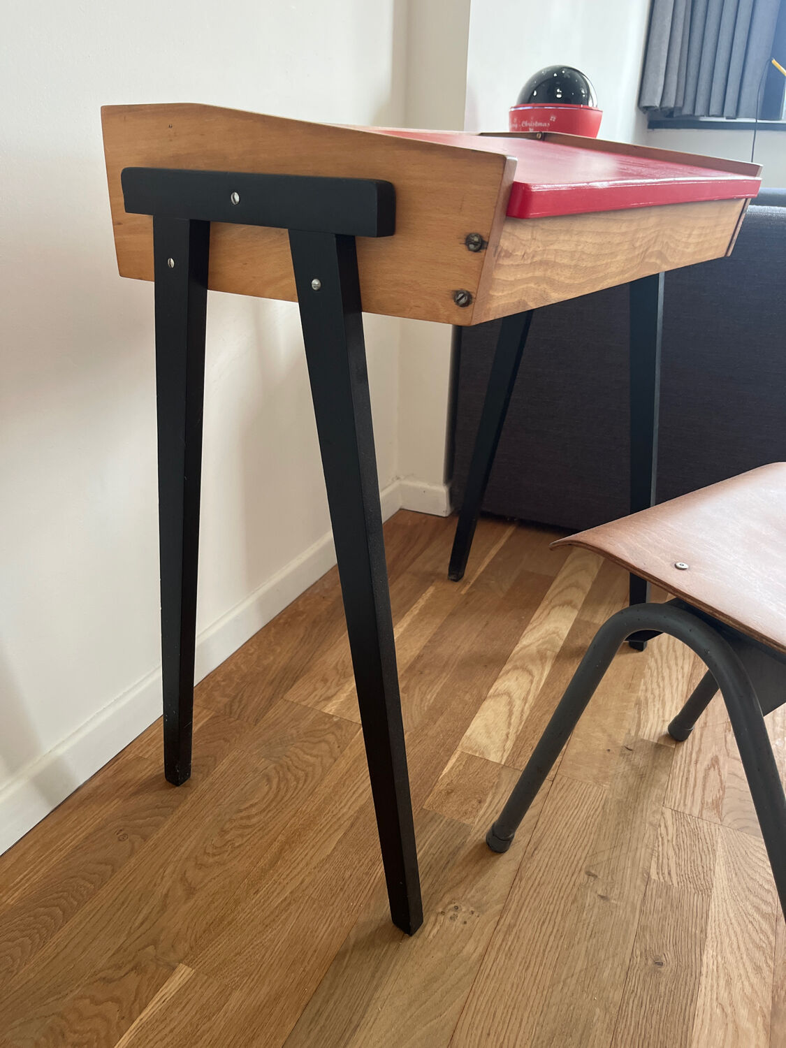 Vintage 1960s school desk with a red Formica top.