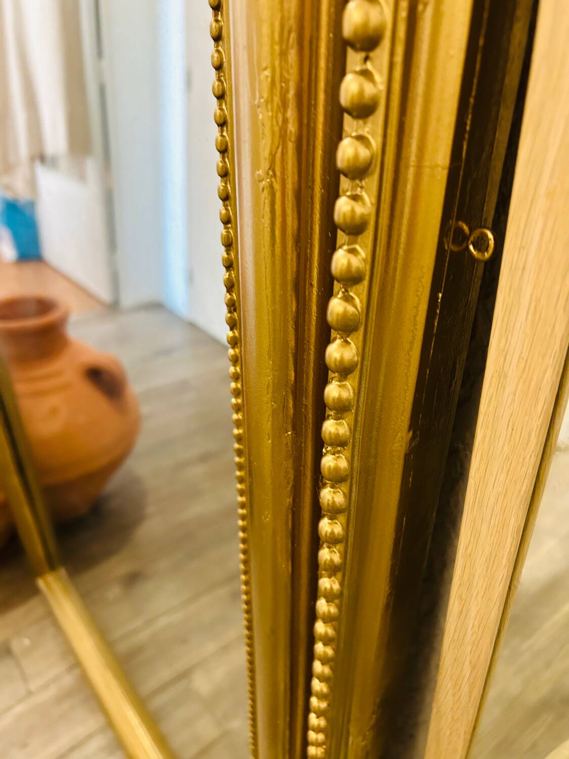 Antique gilded mirror in old Louis Philippe wood