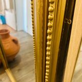 Antique gilded mirror in old Louis Philippe wood