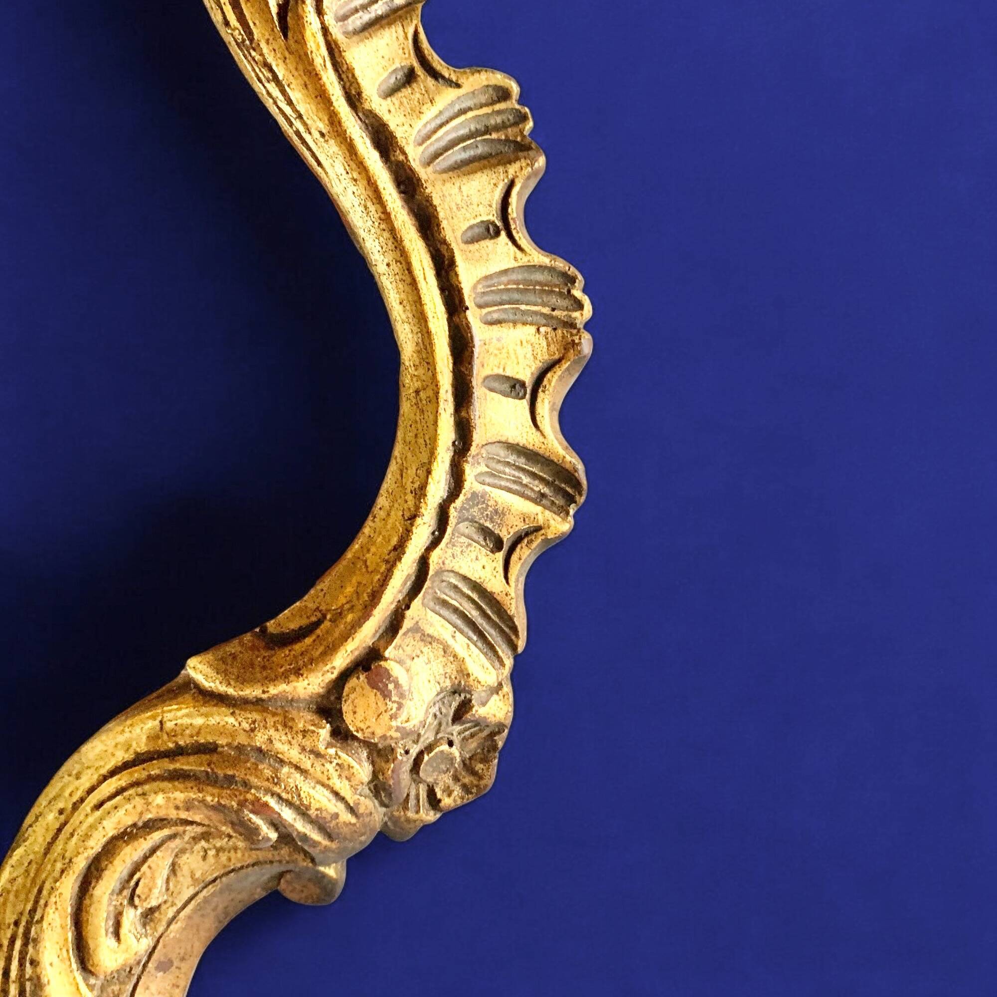 Rococo wall mirror in golden resin
