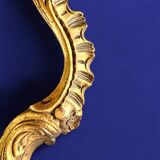 Rococo wall mirror in golden resin
