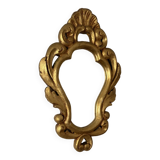 Golden mirror in baroque style.