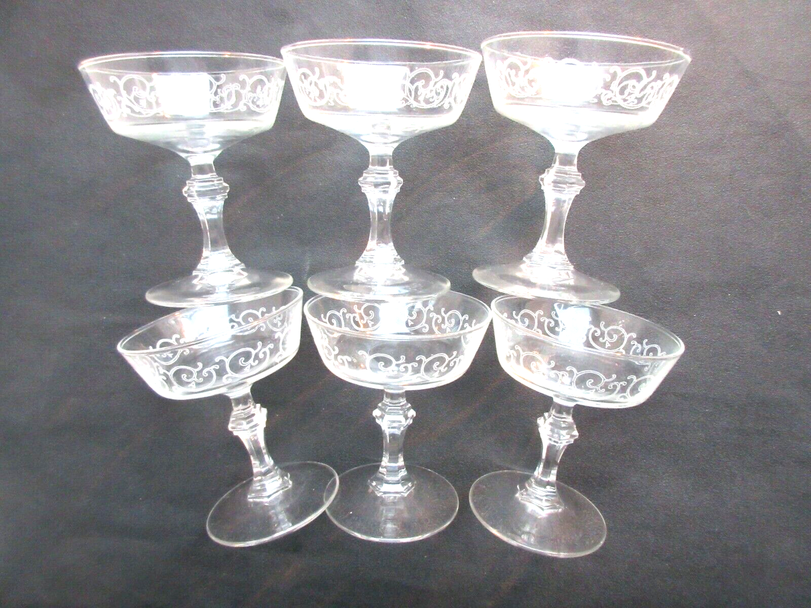 6 Louis XV style champagne glasses engraved with arabesques, baluster foot