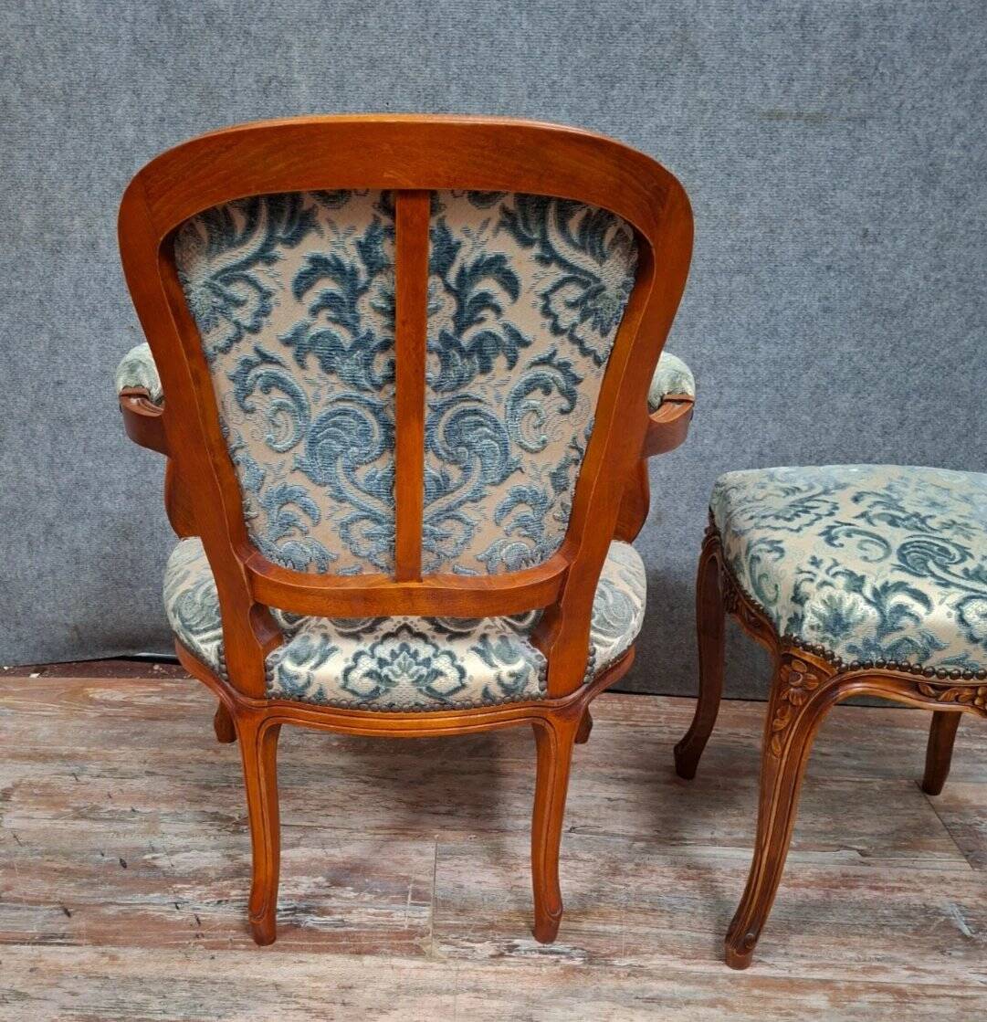 Cabriolet armchair in cherry wood with its footrest, 20th century.