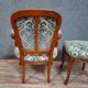 Cabriolet armchair in cherry wood with its footrest, 20th century.