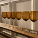6 amber stemmed glasses