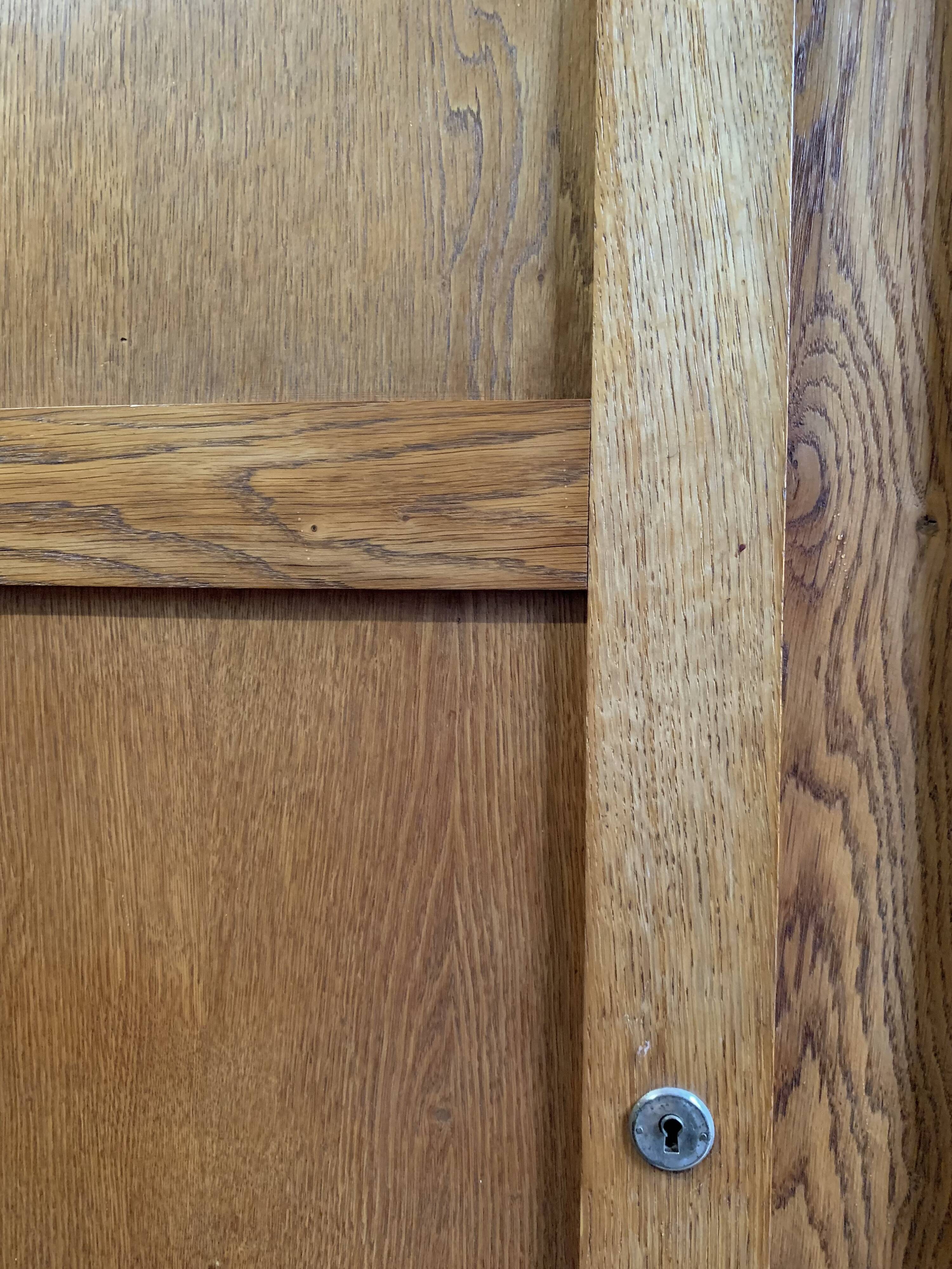 Solid oak compass foot cabinet René Gabriel 1945
