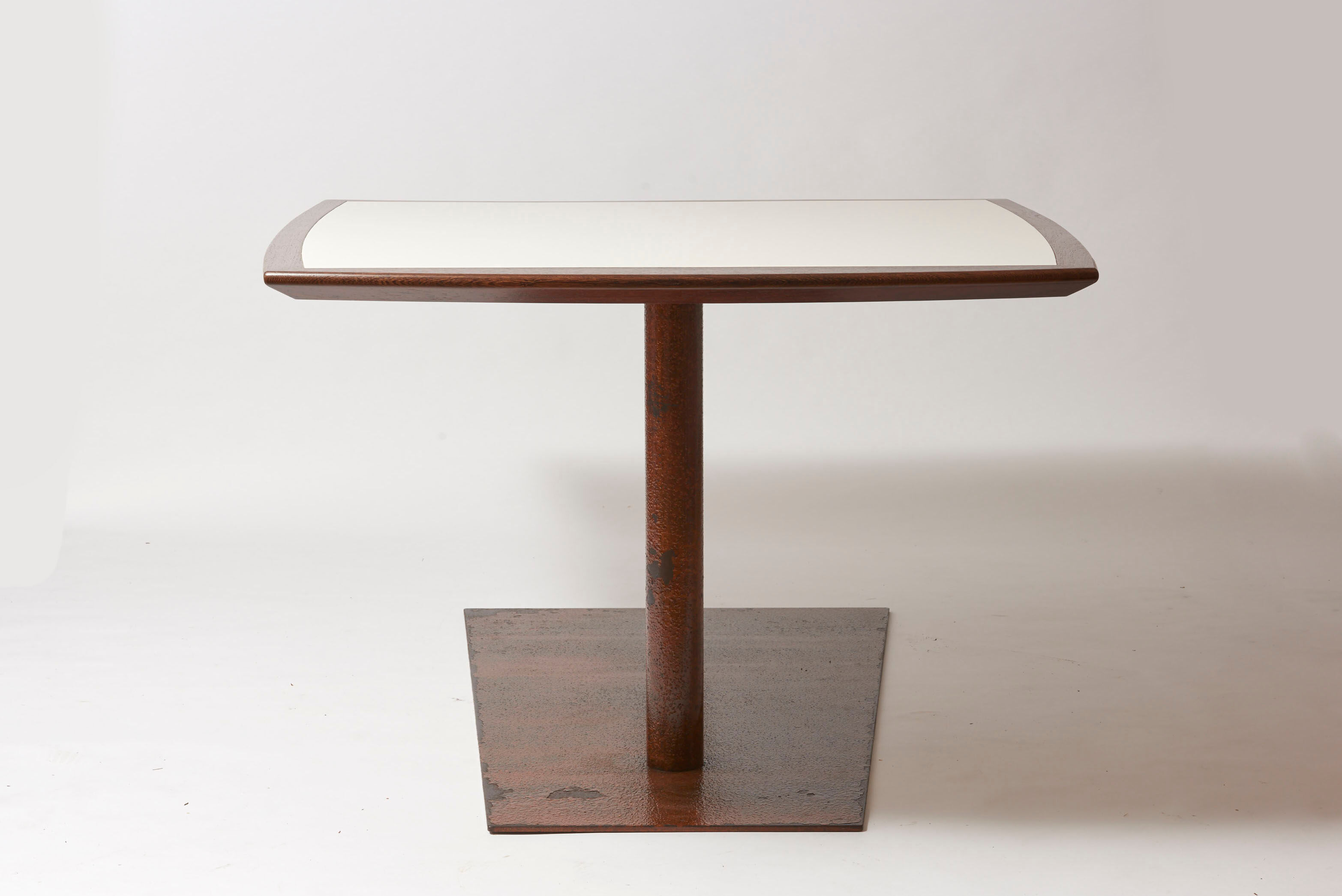 Brutalist conference table made of wood and steel
