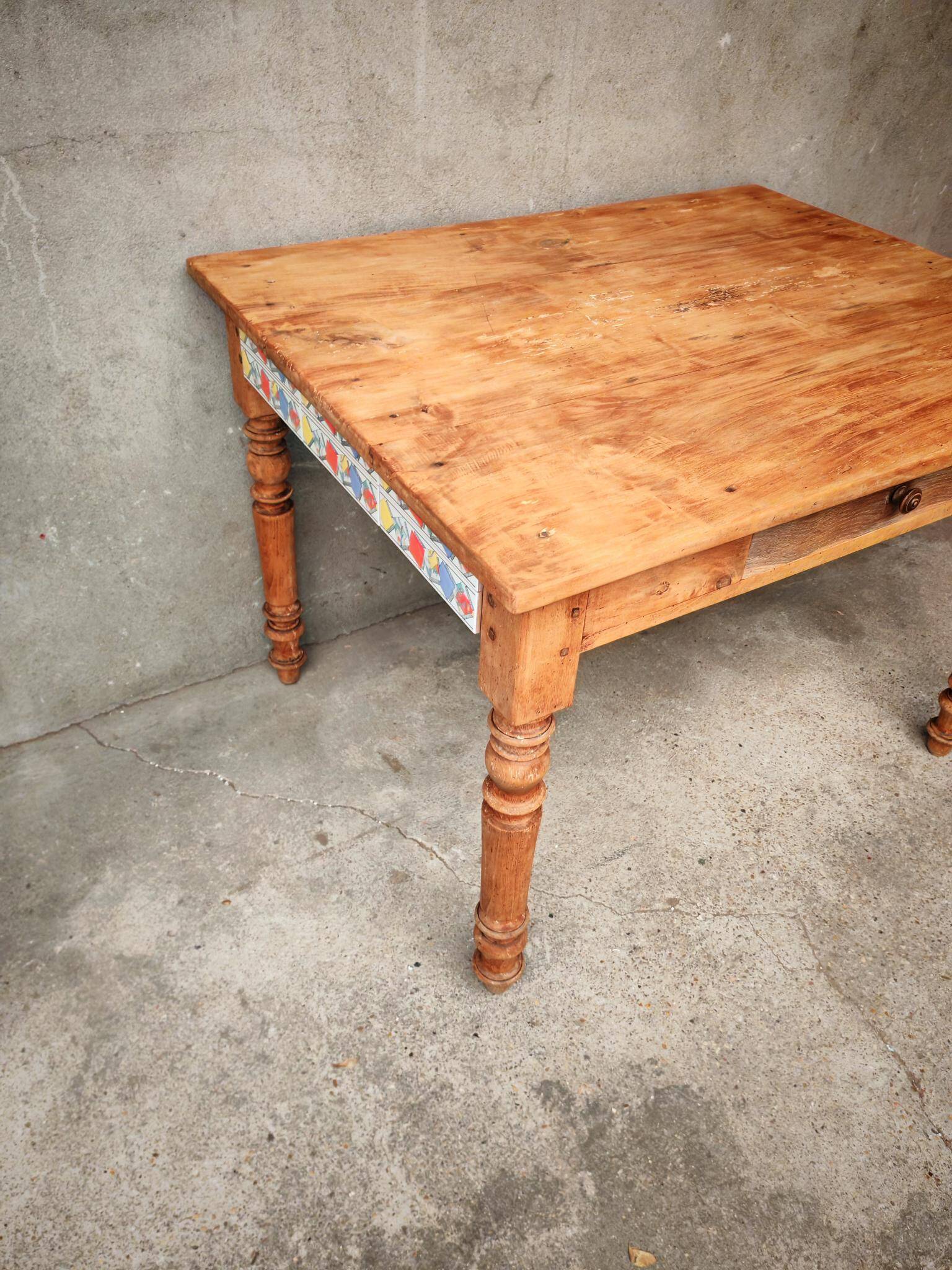 Small farmhouse table in light wood and tiled floors