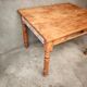 Small farmhouse table in light wood and tiled floors
