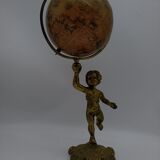 Cherub or putti carrying a globe