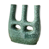 Artisanal vase in black and blue.