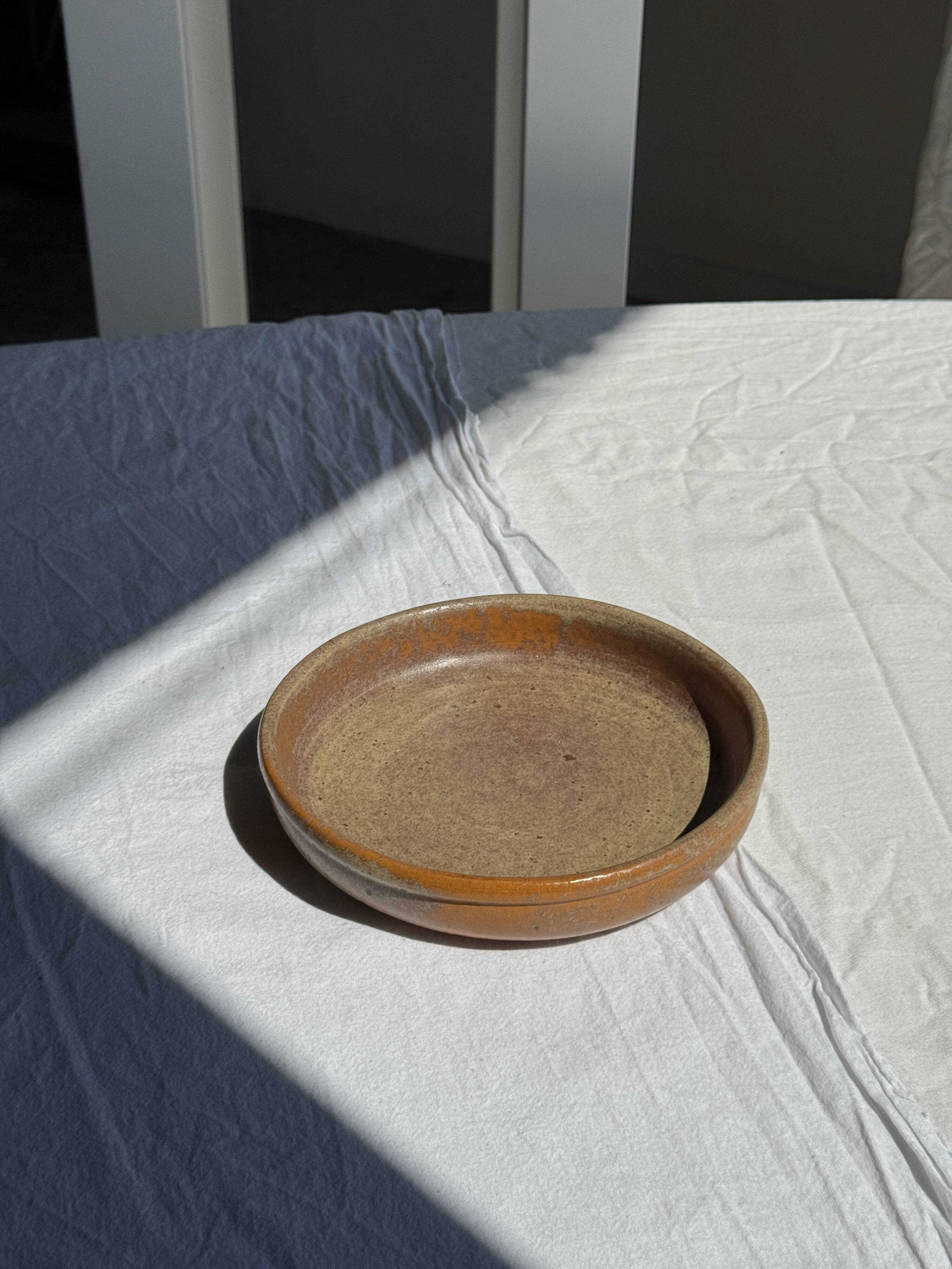 A small vintage circular stoneware deep dish D19