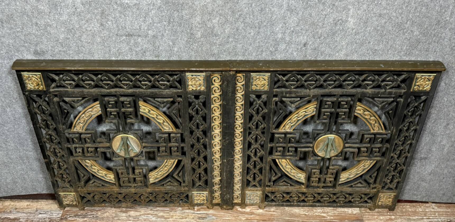 pair of monogrammed cast iron doors from the Art Deco period