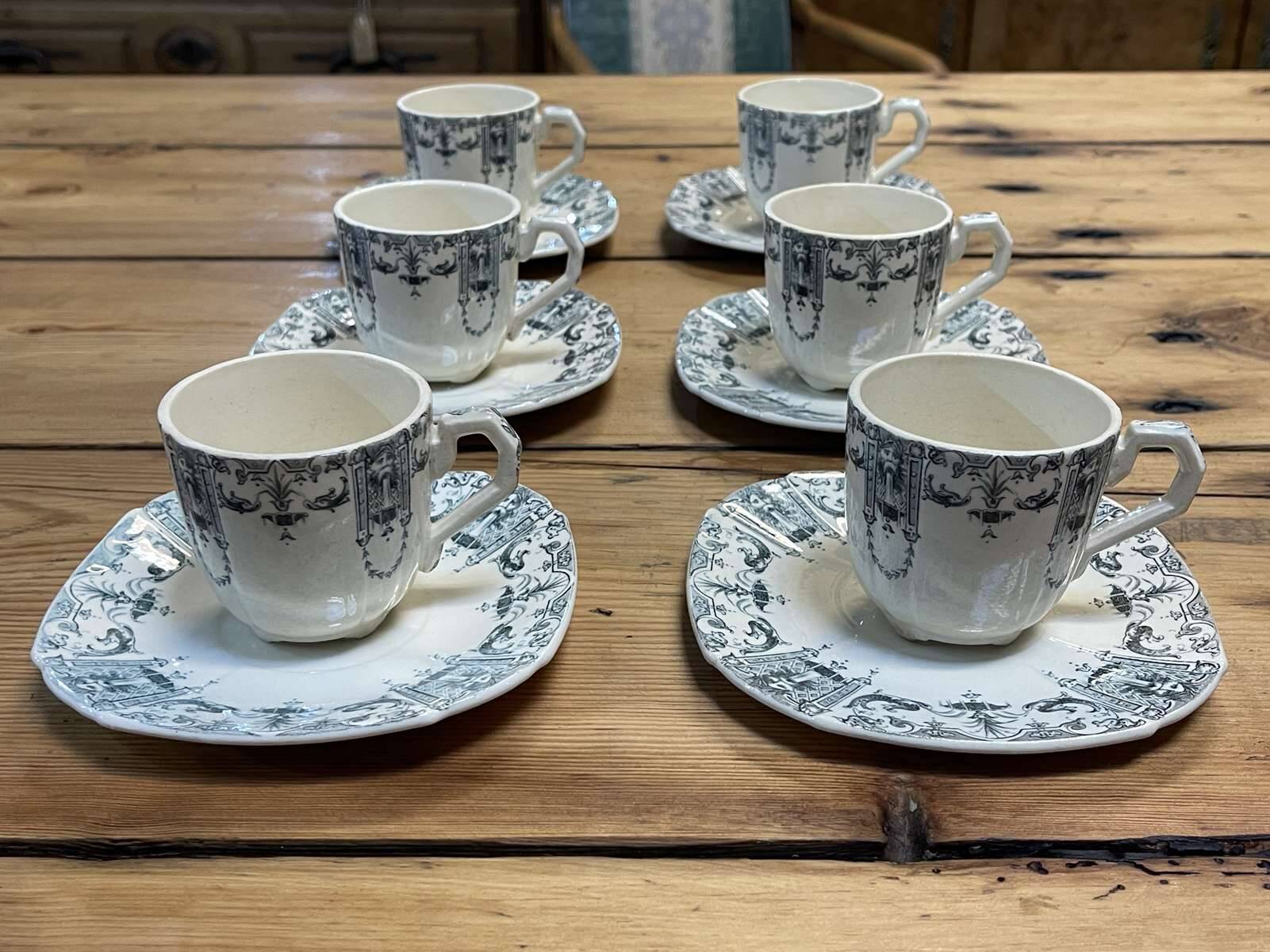6 cups and saucers in Gien earthenware with Mascaron decoration from the early 20th century.