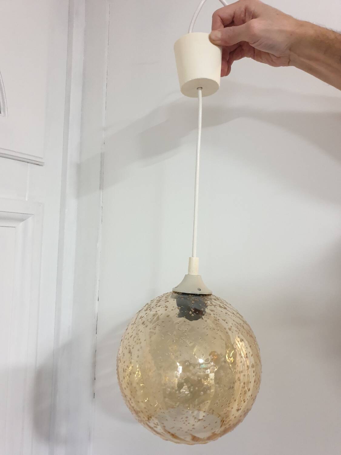 Vintage globe pendant in amber bubble glass