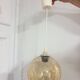 Vintage globe pendant in amber bubble glass