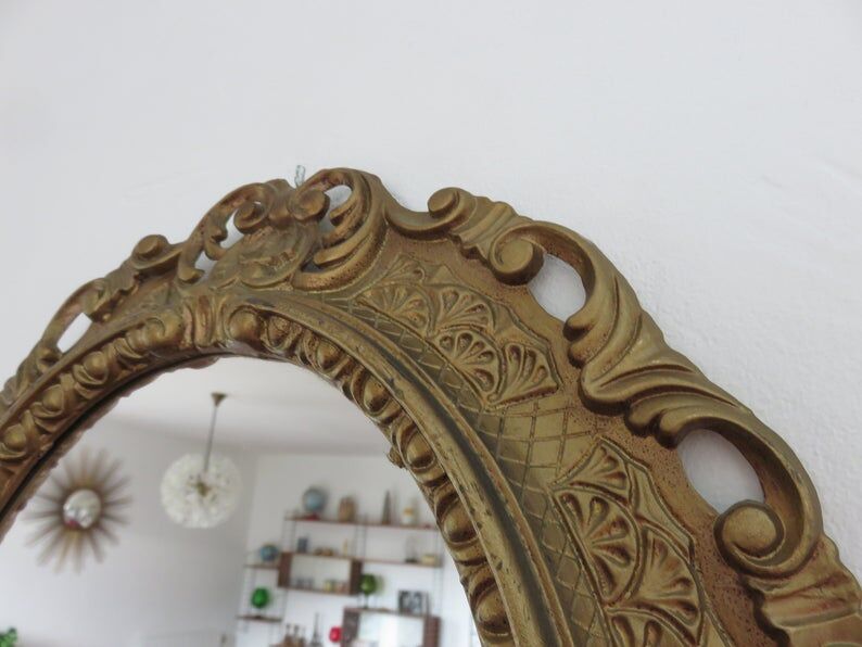 Golden baroque oval mirror, 60s-70s