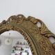 Golden baroque oval mirror, 60s-70s