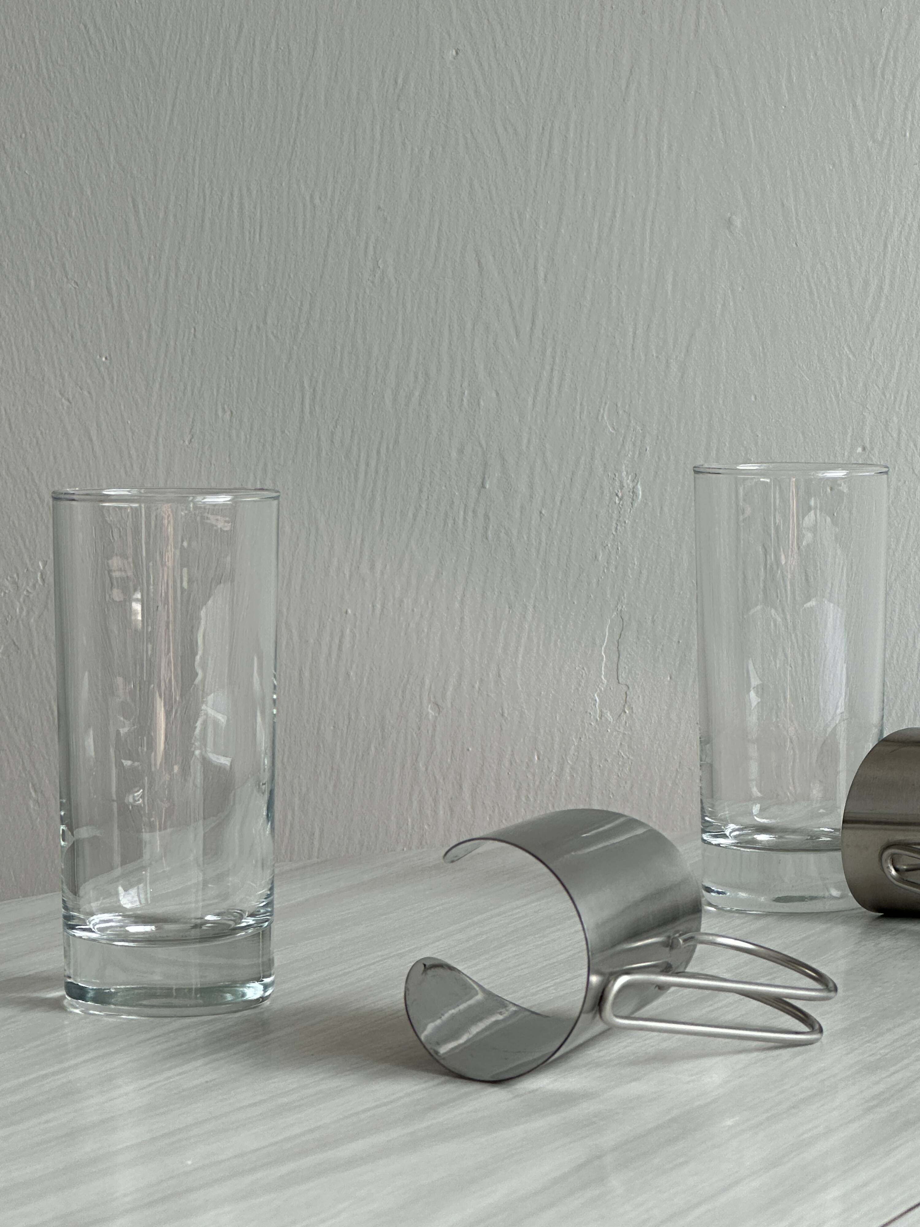 2 glasses with metal handles, stainless steel.