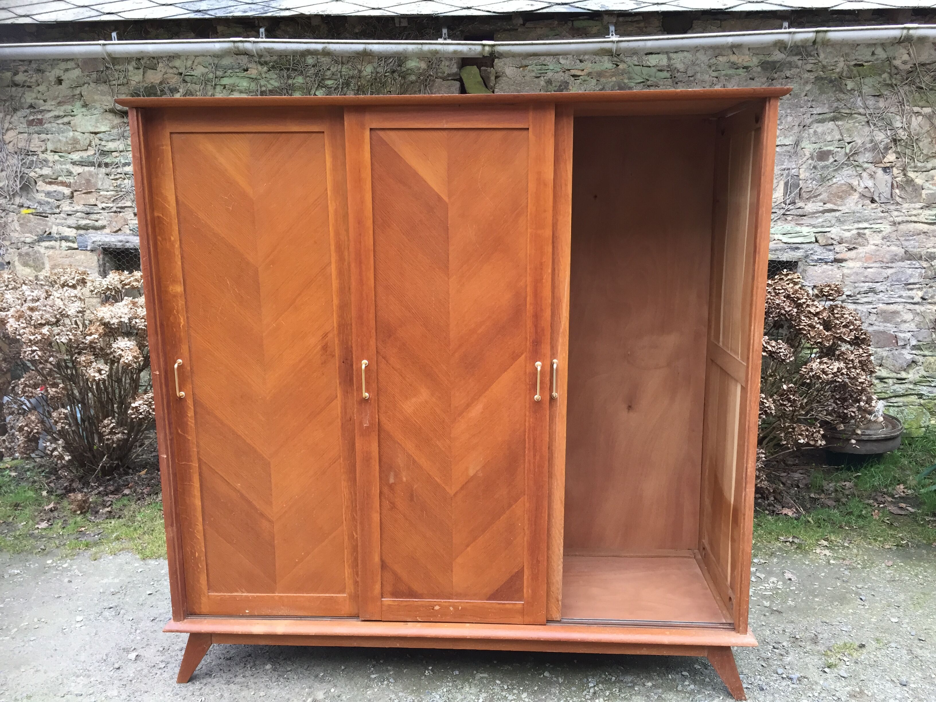 Vintage wardrobe compass feet with 3 sliding oak doors.