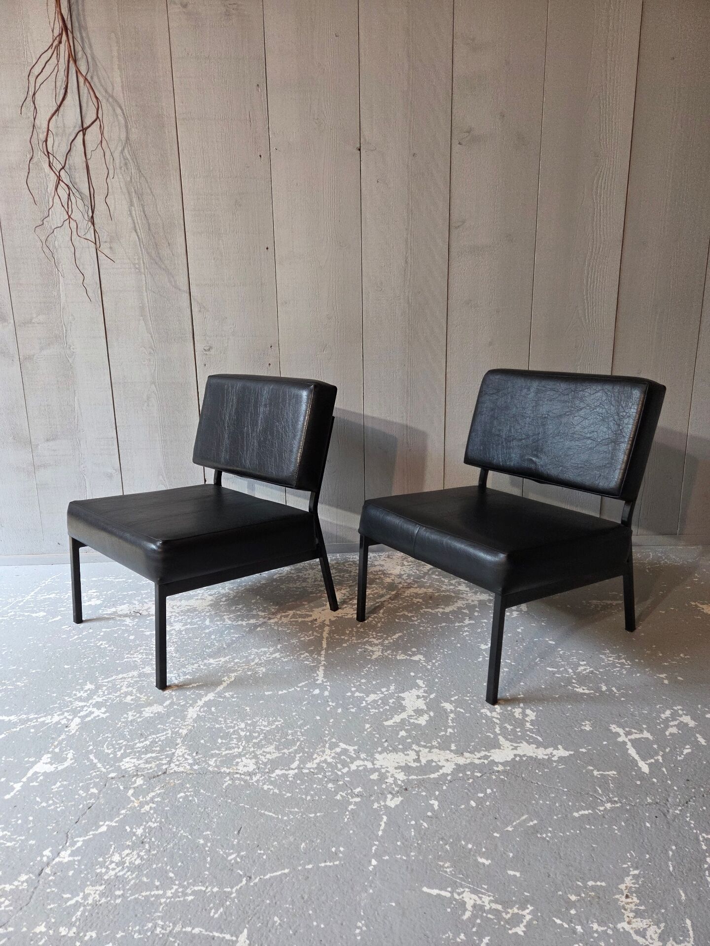 2 faux leather armchairs