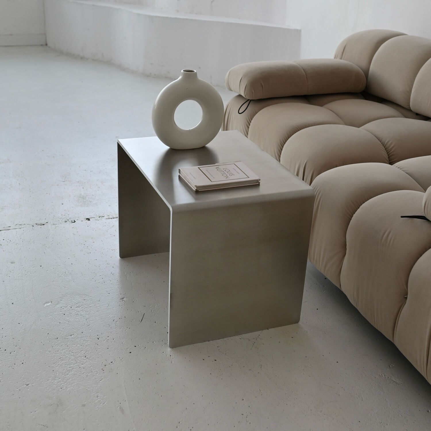 Minimalist brushed aluminum side table