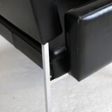 Pair of stainless steel, black leather-like armchairs, France, circa 1970