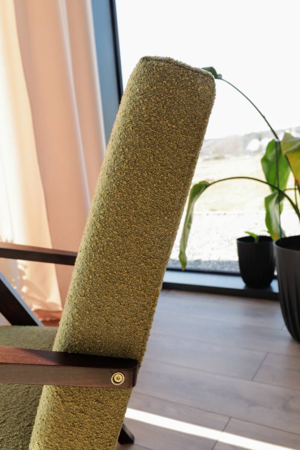 Vintage armchair in moss green bouclé design by H. Lis.