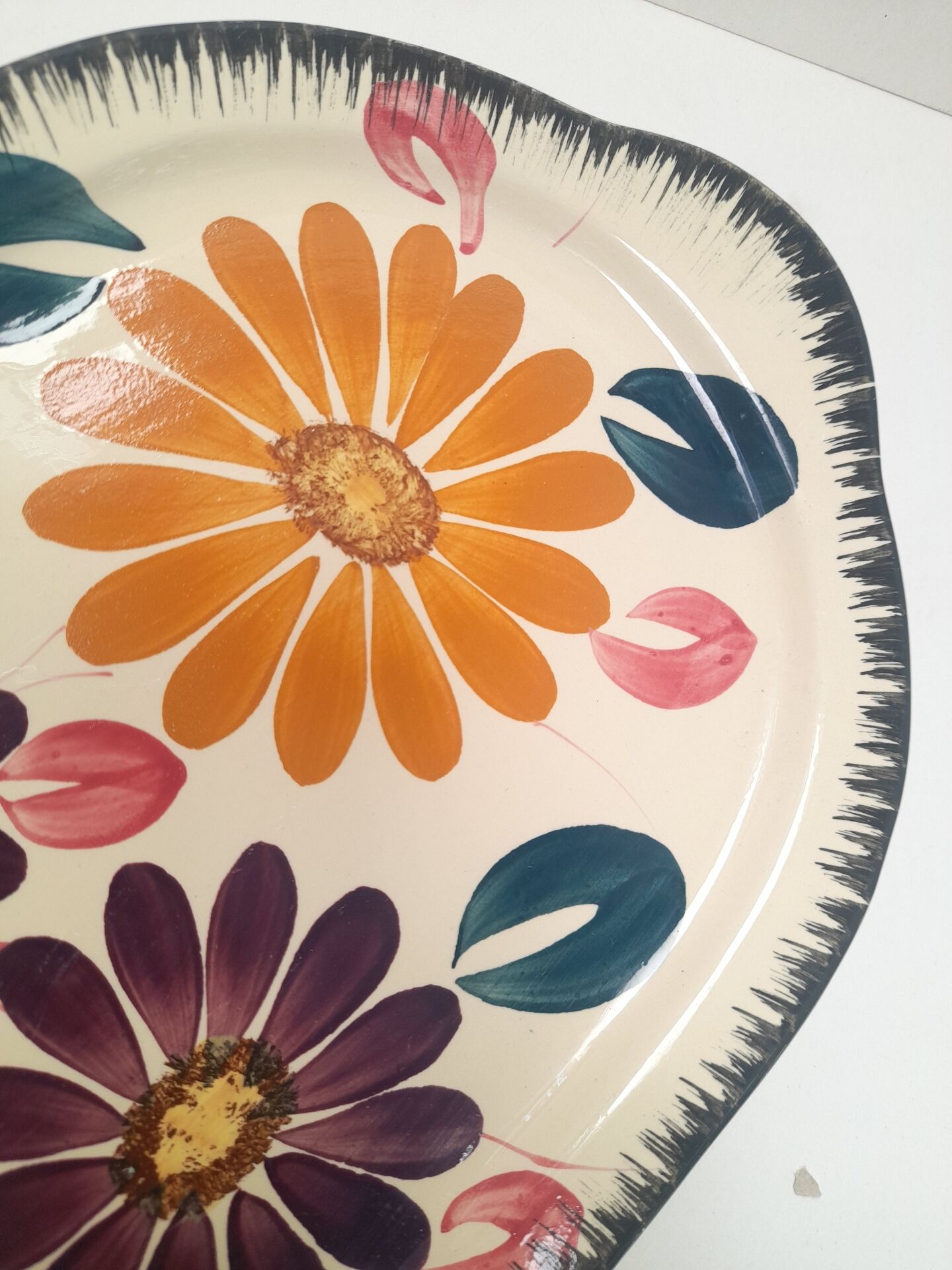Floral cake dish in Boch brothers earthenware