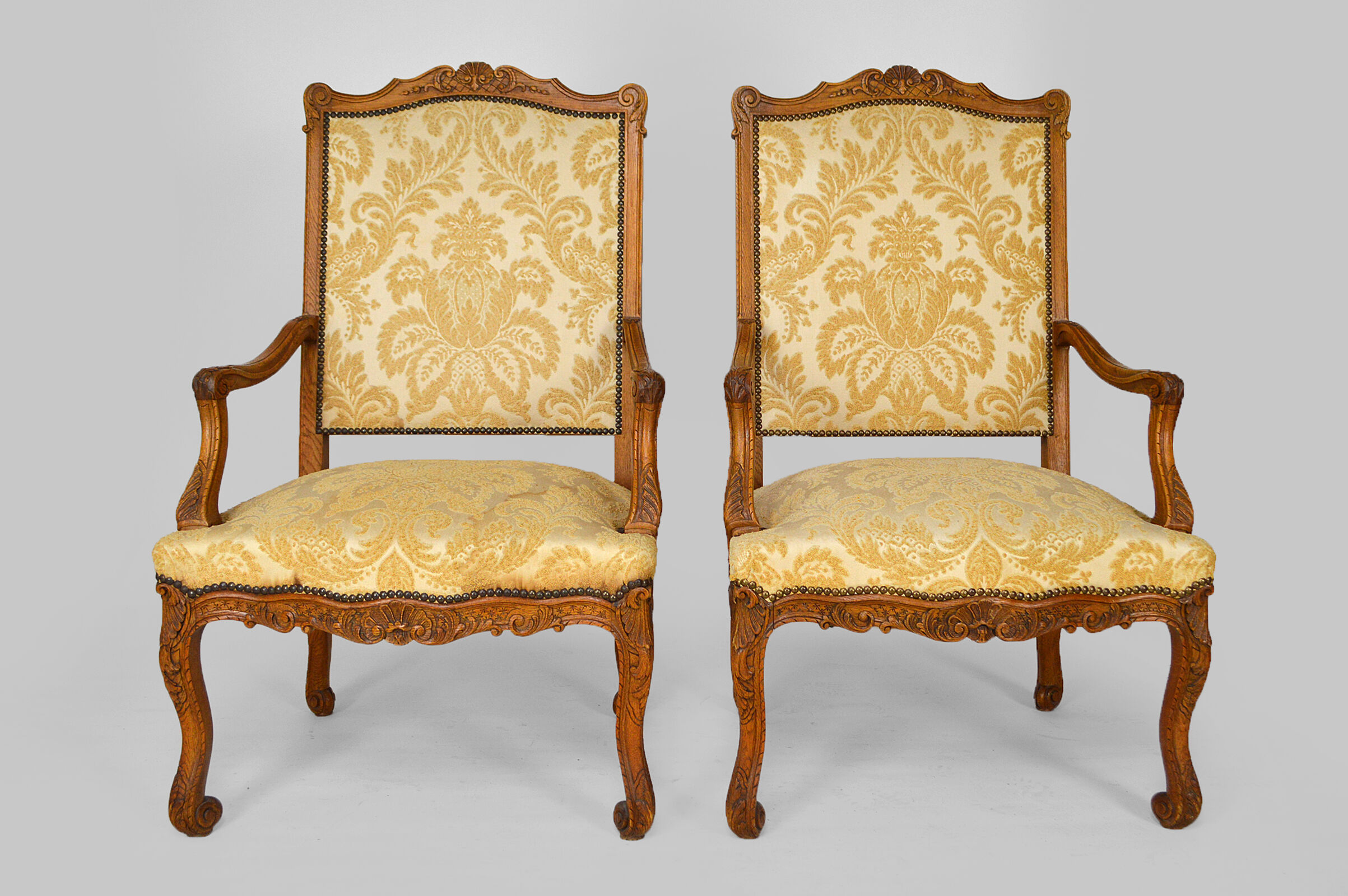 Set of 2 armchairs in carved oak, Louis XV style