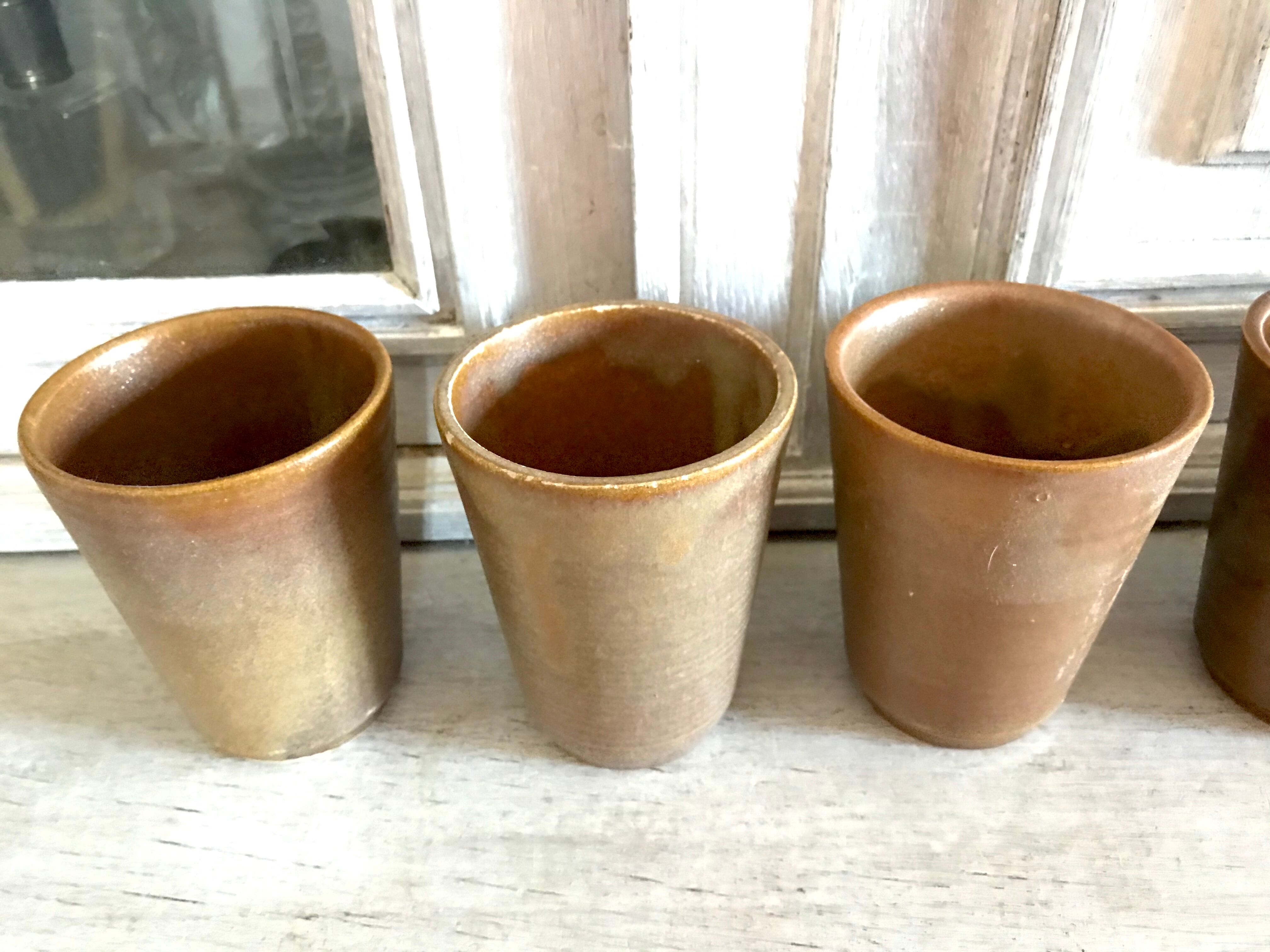 Lot of six Digoin mugs in sandstone