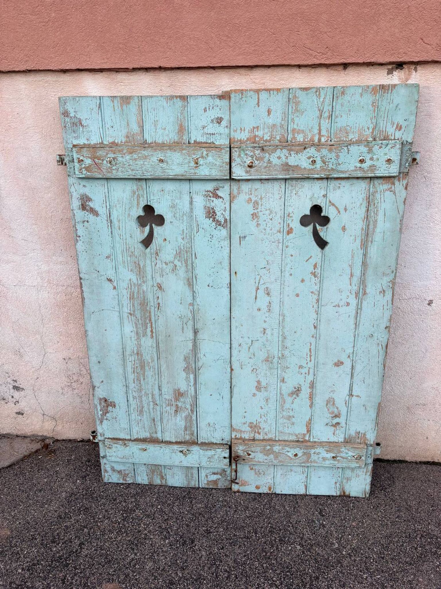 Pair of green wooden shutters