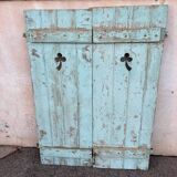 Pair of green wooden shutters
