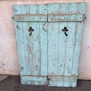 Pair of green wooden shutters