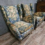 Pair of vintage armchairs with enveloping backrest.