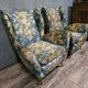 Pair of vintage armchairs with enveloping backrest.
