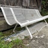 Old perforated metal garden bench
