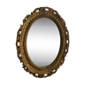 Ancien miroir ovale en résine dorée