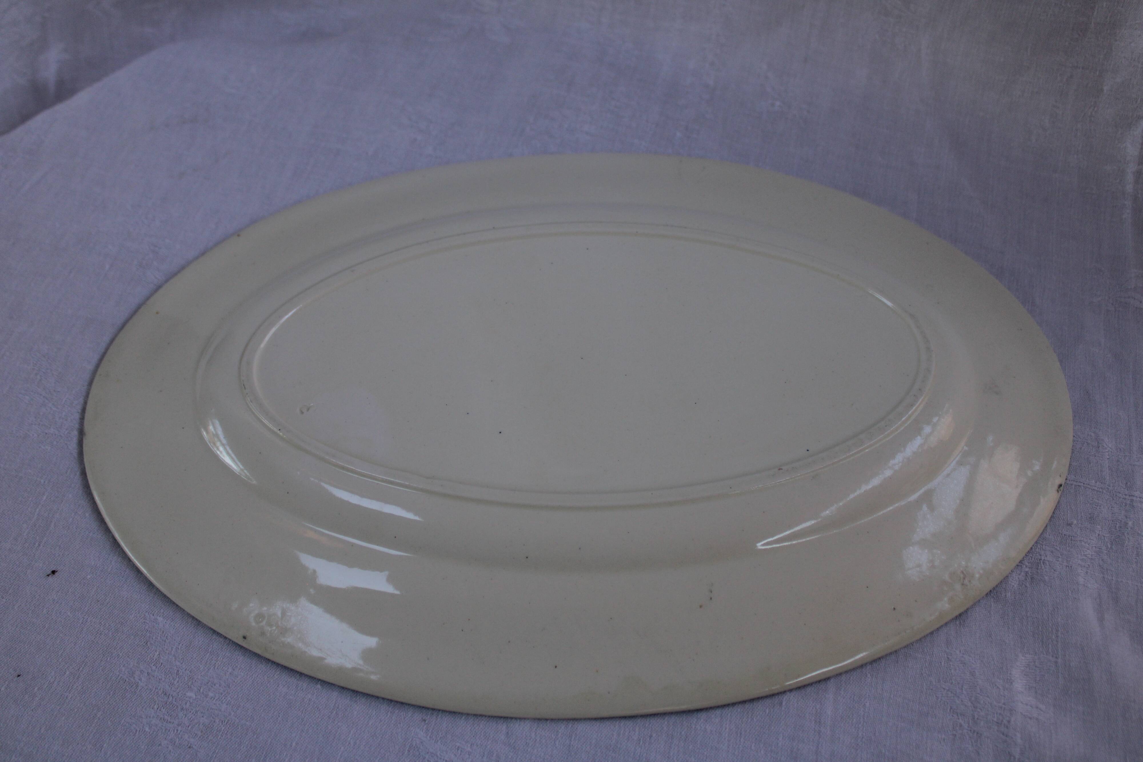 Oval plate in earthenware decoration garland Louis XVI green