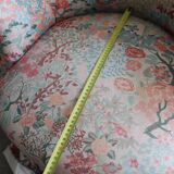 pair of toad armchairs in floral fabric.