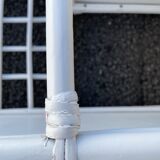 White rattan shelf with braces