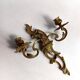 Pair of Rococo wall sconces in gilded bronze, Hollywood Regency, from the years.