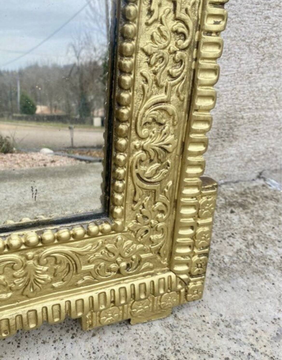 19th-century antique mirror in carved gilded wood, Napoleon style.