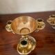 Pair of solid brass calyx candlesticks