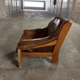 Armchairs in leather and vintage wood 70's